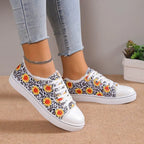 Women’s low top floral canvas shoes with breathable design from Trendy Attic Store01, showcasing colorful floral pattern and casual style.