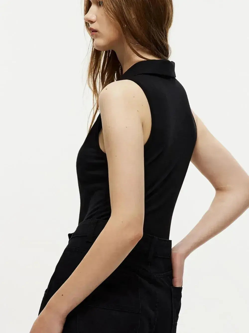 Women's sleeveless collared bodysuit with quarter-zip neckline, slim-fit jumper from Plush Fashion Hub, shown on a neutral background.