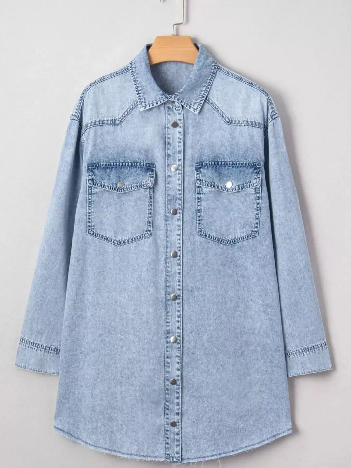 Relaxed cotton denim shirt dress with button-down front, pockets, and raw hem, by Plush Fashion Hub.