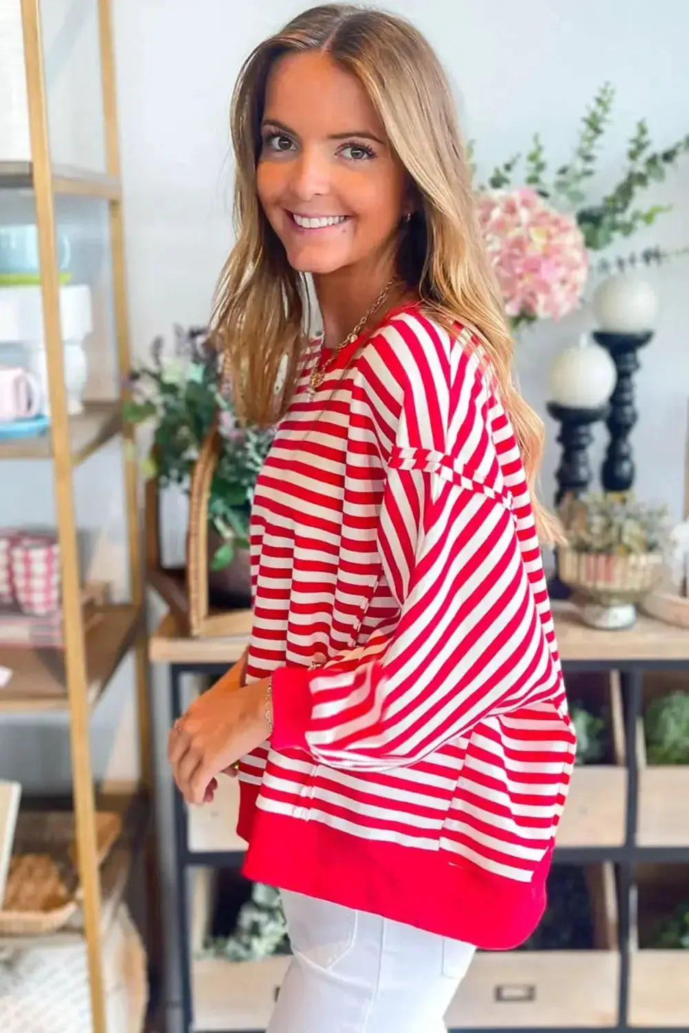 Red striped drop shoulder long sleeve top with exposed seams by Plush Fashion Hub, stylish and comfortable women's long sleeve top.
