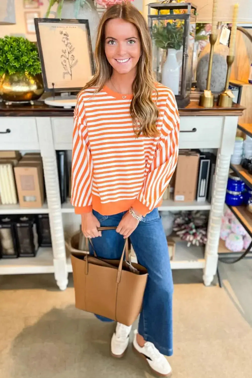 Red striped drop shoulder long sleeve top with exposed seams from Plush Fashion Hub, showcasing a casual yet stylish design.