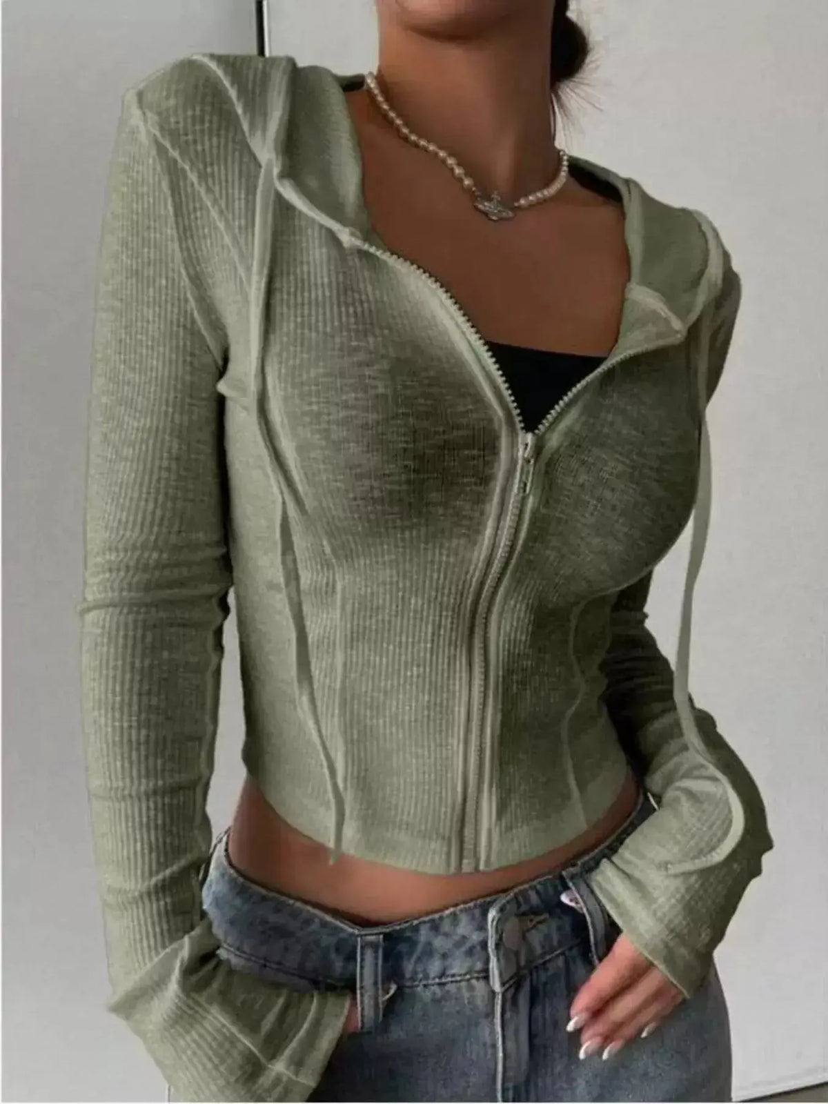 Women's ribbed knit cropped zip-up hoodie jacket by Plush Fashion Hub, featuring a hood and fitted design.