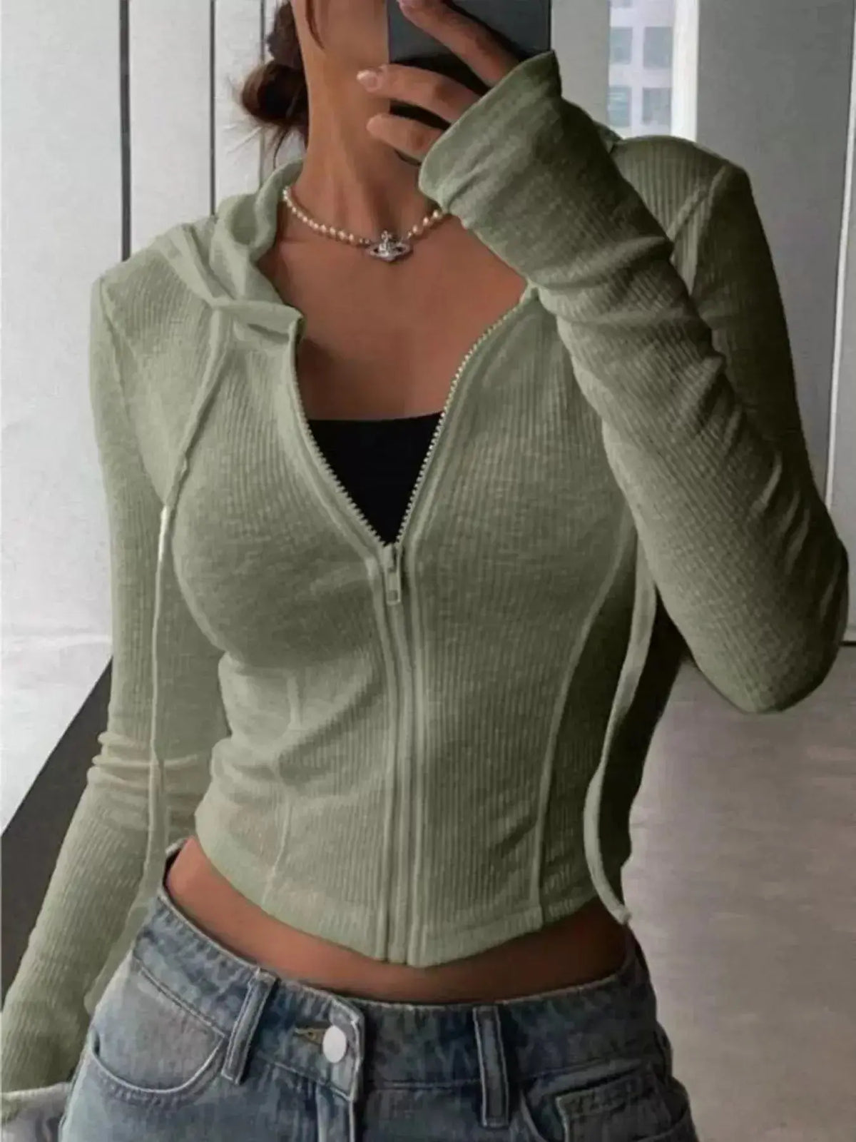 Women's ribbed knit cropped zip-up jacket with hood, stylish outerwear from Plush Fashion Hub, shown in a close-up view.