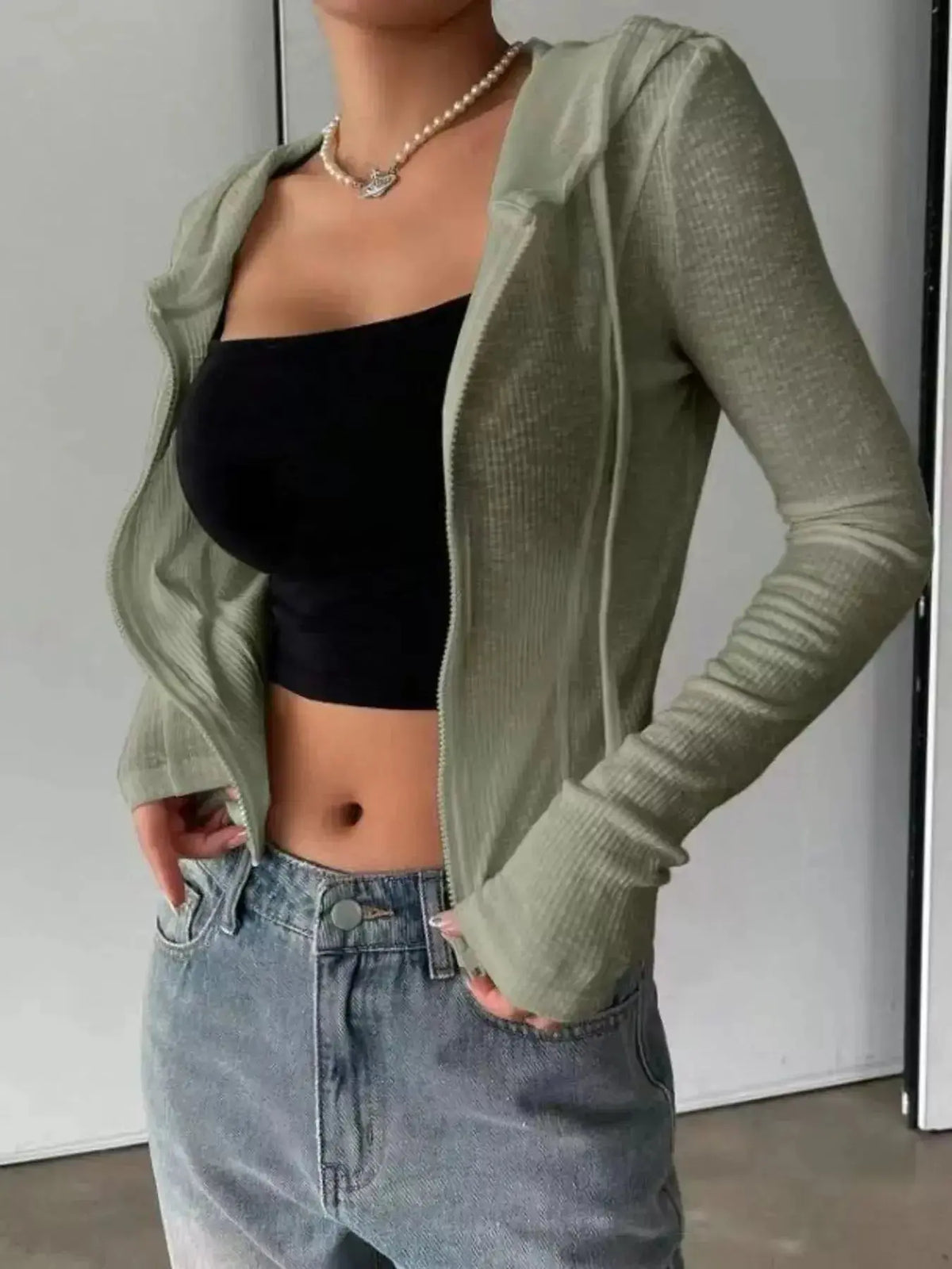 Women's ribbed knit cropped zip-up hoodie jacket from Plush Fashion Hub, featuring a hood and fitted ribbed design.