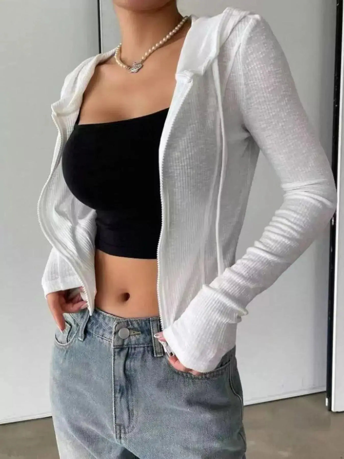 Women's ribbed knit cropped zip-up jacket in soft outerwear style by Plush Fashion Hub, featuring a hood and fitted design.