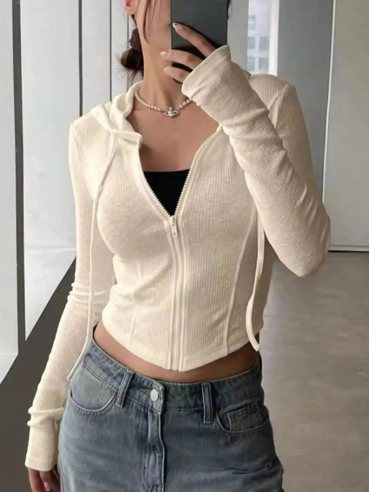 Women's ribbed knit cropped zip-up jacket with hood, stylish outerwear by Plush Fashion Hub, shown in a close-up view.