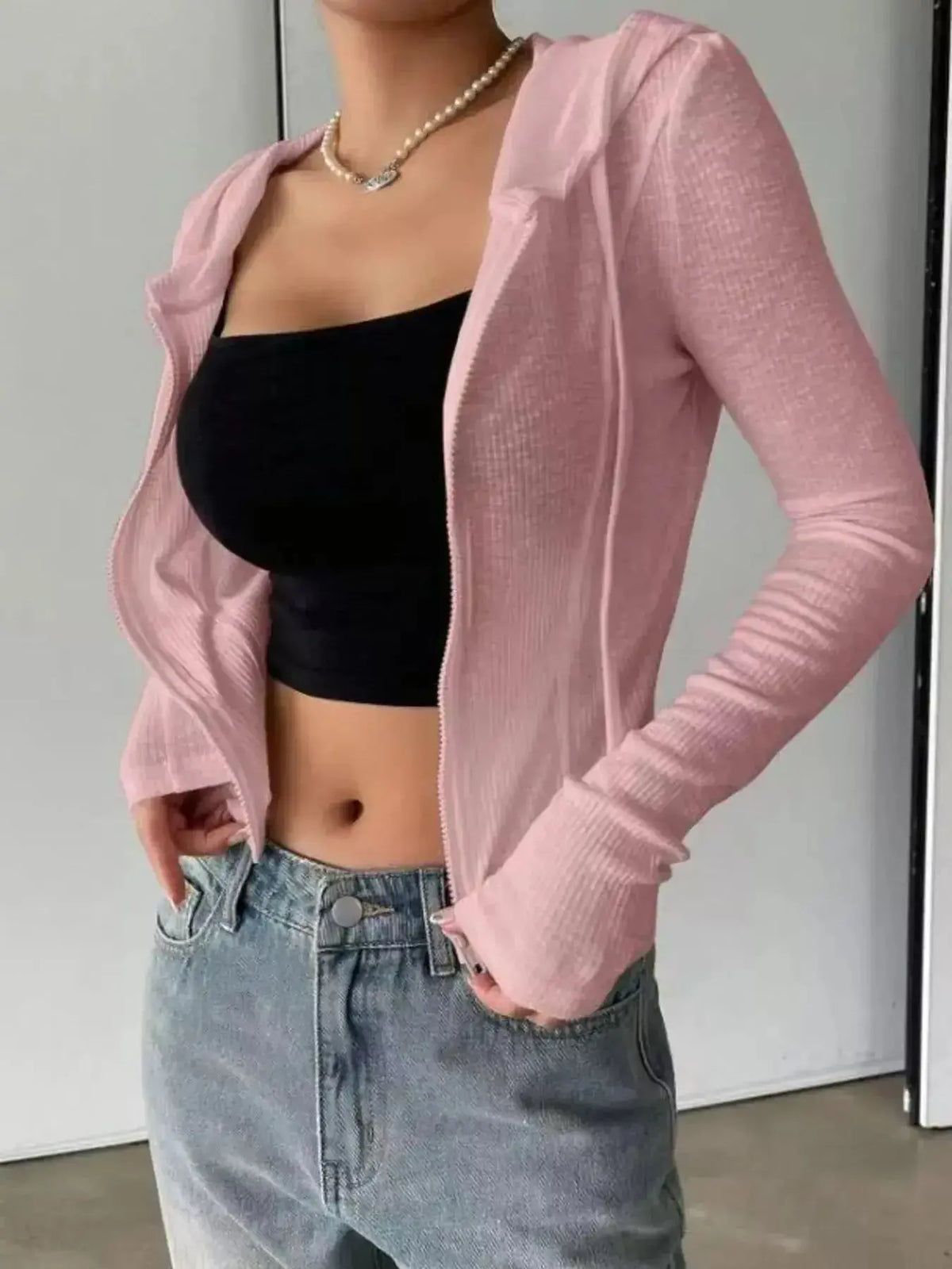 Women's ribbed knit cropped zip-up jacket with hood, stylish outerwear by Plush Fashion Hub featuring a fitted design.