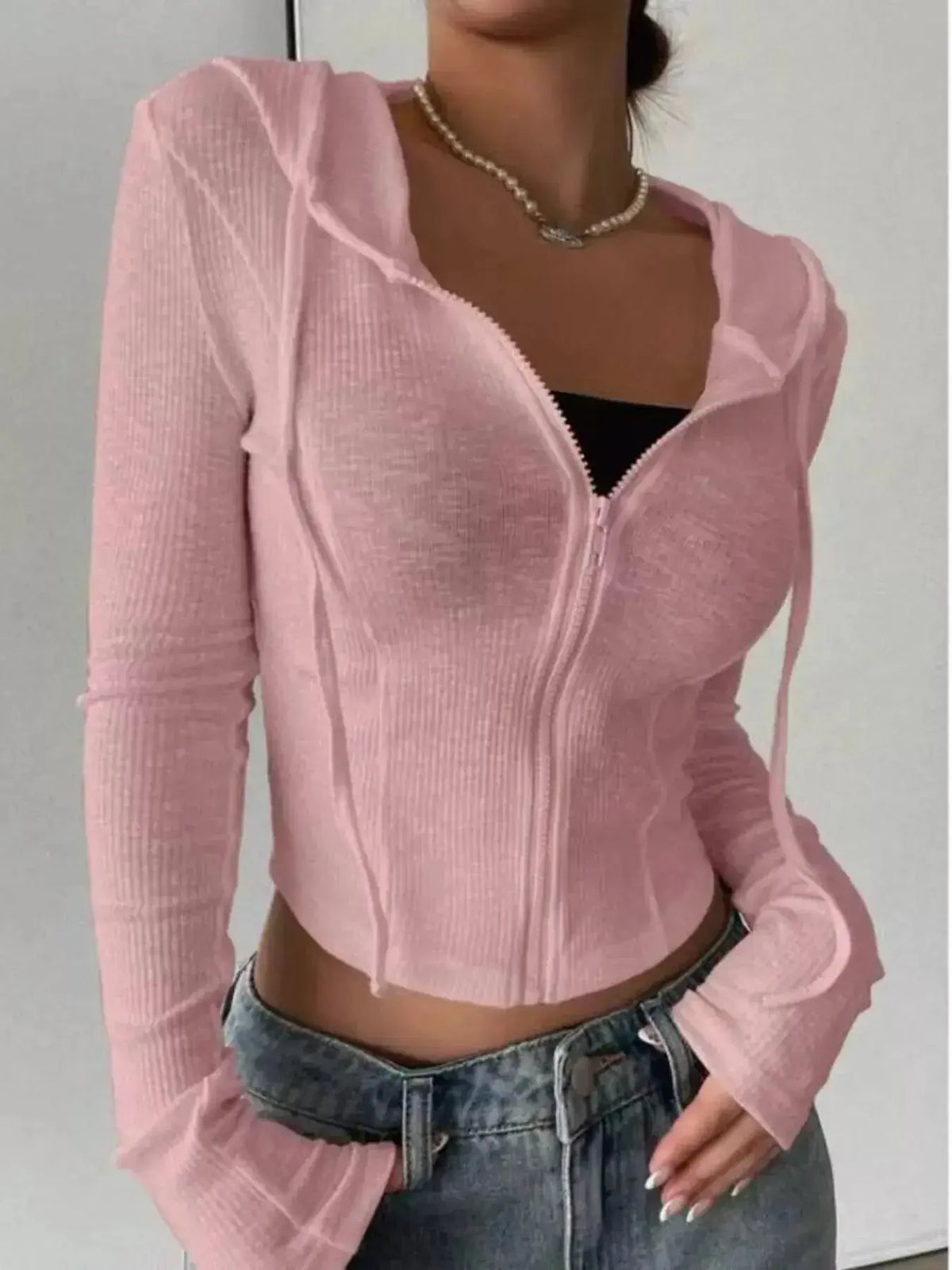 Women's hooded ribbed knit cropped zip-up jacket from Plush Fashion Hub, featuring a cozy design with a front zipper and ribbed texture.