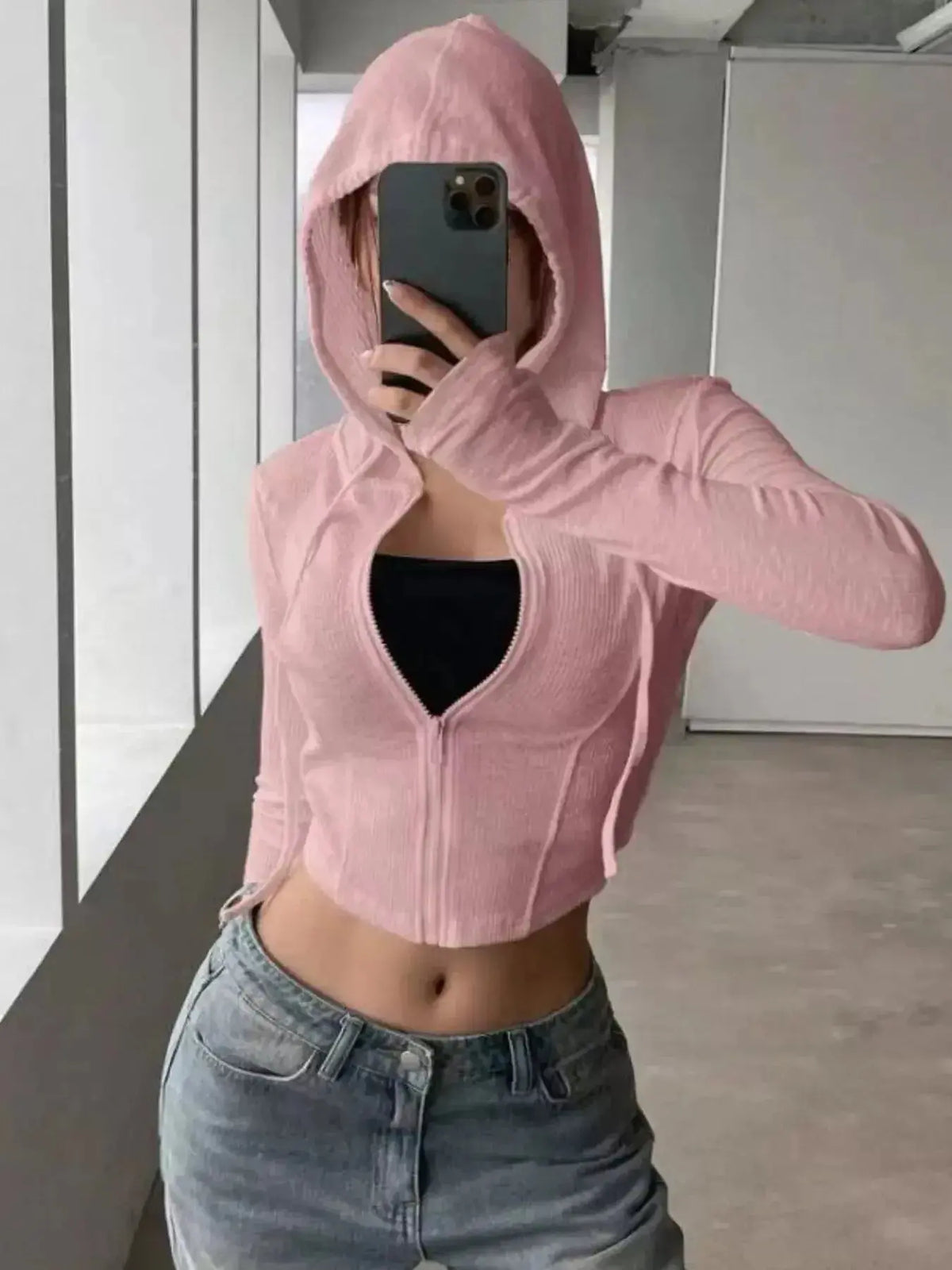 Women's ribbed knit cropped zip-up jacket with hood, stylish outerwear from Plush Fashion Hub, shown in a close-up view.