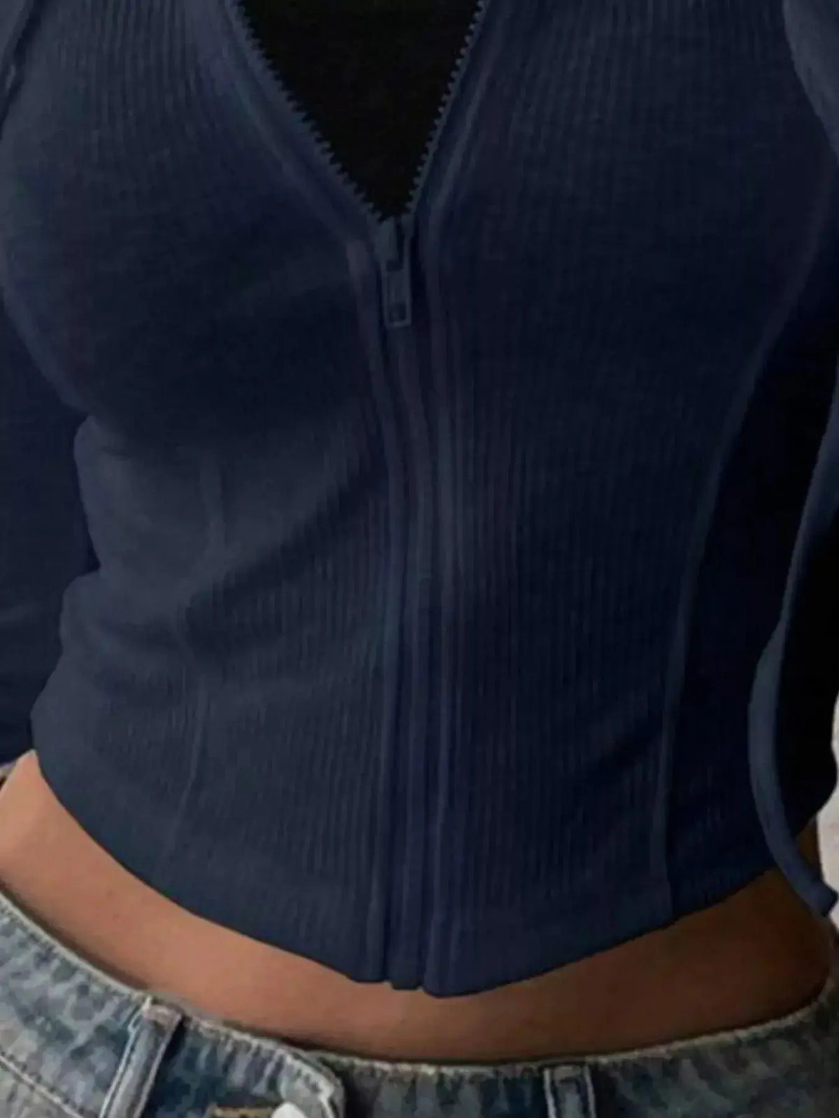 Women's ribbed knit cropped zip-up jacket by Plush Fashion Hub, featuring a hood and stylish outerwear design.