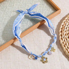 Elegant floral ribbon flower charm necklace for women with a delicate pendant, featuring a soft ribbon and floral design.