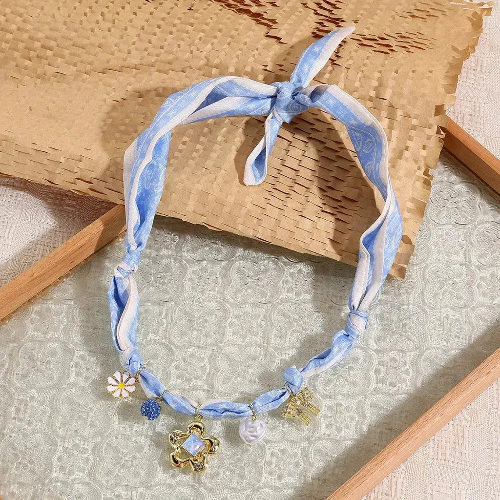 Elegant ribbon flower charm necklace with floral pendant, crafted by Plush Fashion Hub, perfect for women's jewelry collection.