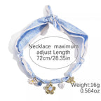Elegant ribbon flower charm necklace with floral pendant jewelry for women, featuring delicate floral design and charming details.