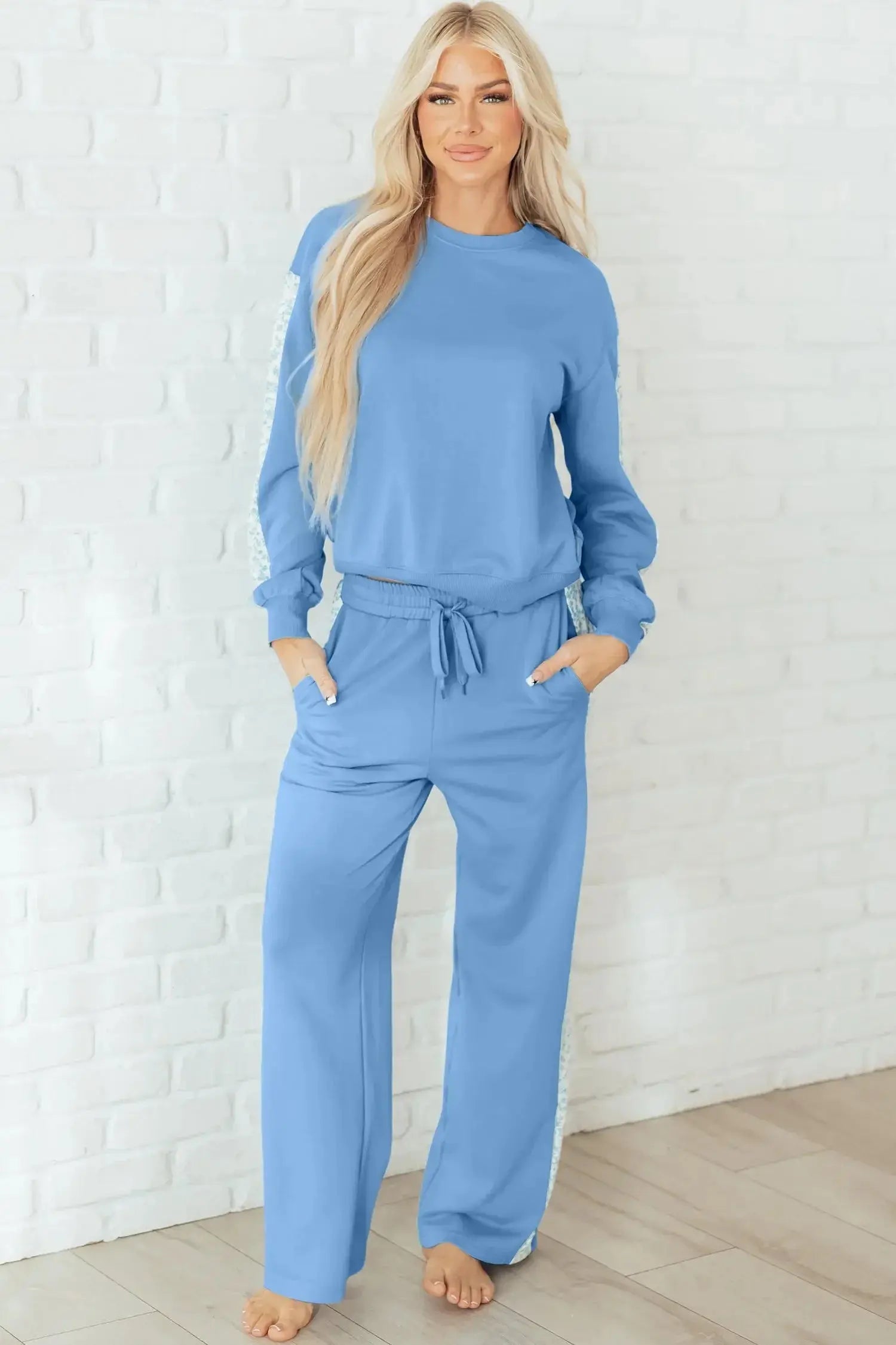 Robin and sweatpants lounge set by Threaded Pear, featuring a cozy robin-themed top and matching comfortable sweatpants.