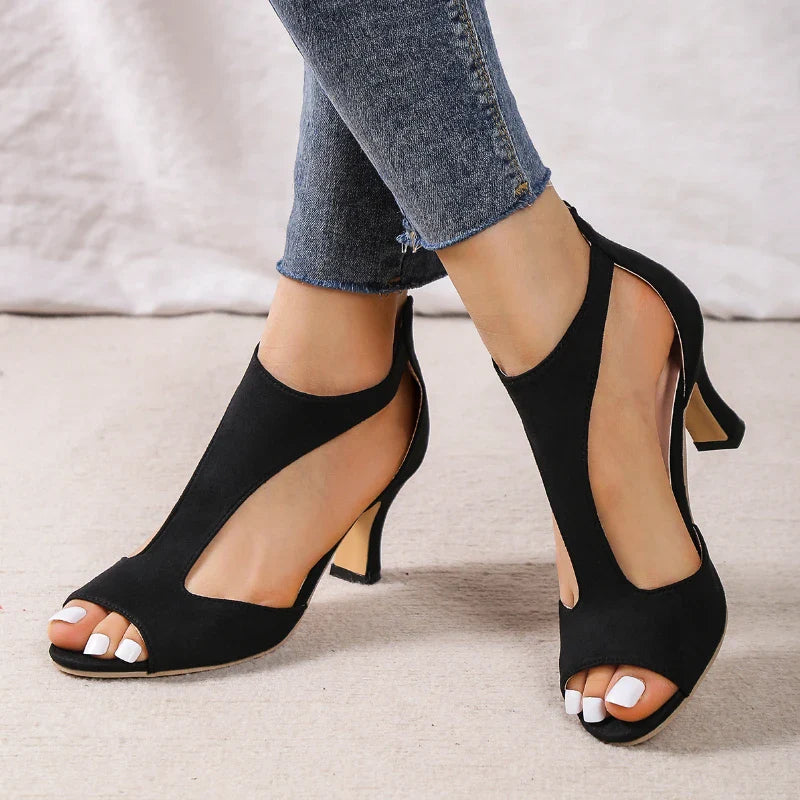 Elegant black leather high heels shoes from Plush Fashion Hub, showcasing sleek pointed toes and stylish heel design.