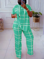 Plus size women’s striped grid printed two-piece casual outfit with round neck from Plush Fashion Hub, featuring a stylish and comfortable design.
