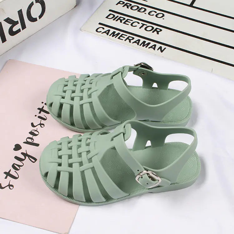 Girls hollow casual flat sandals by Trendy Attic Store01, featuring open toes and comfortable design for boys and girls.