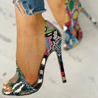 Women’s floral peep-toe high heels by Trendy Attic Store01, stylish footwear with vibrant flower patterns and elegant design.