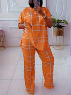 Plus size women's two-piece casual outfit by Plush Fashion Hub featuring a striped grid printed round neck top and matching pants.