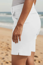 Women’s summer stretch hiking shorts by FitiqueFit, casualwear with a comfortable fit, shown in a versatile outdoor setting.