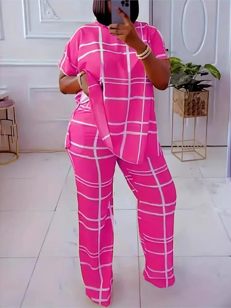 Plus size women's two-piece outfit by Plush Fashion Hub featuring a striped grid printed casual round neck top and matching pants.