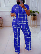 Plus size women’s casual two-piece set with striped grid print and round neck by Plush Fashion Hub, featuring a stylish, comfortable outfit.
