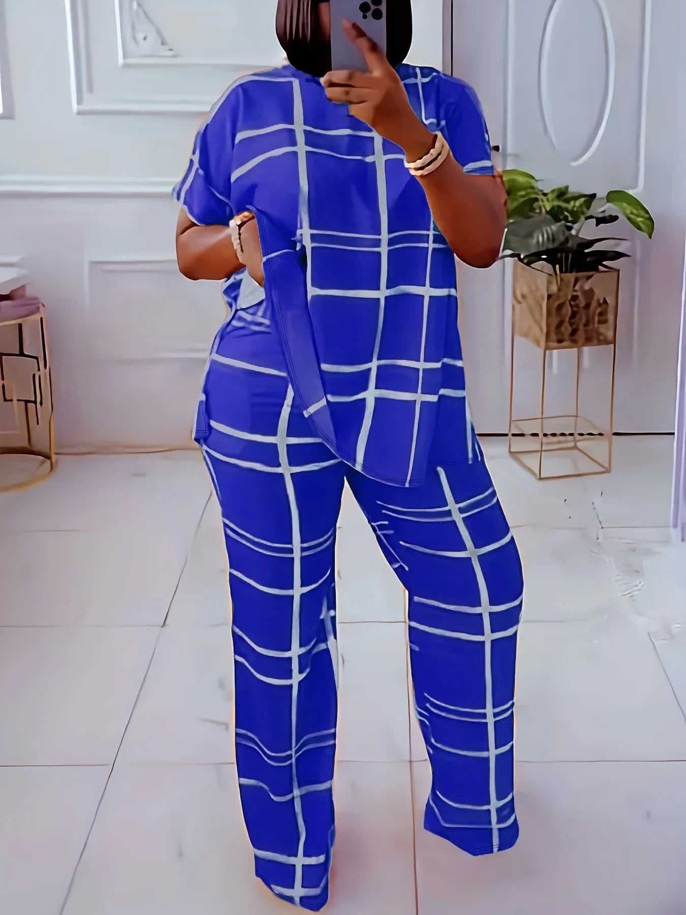 Plus size women’s casual two-piece set with striped grid print and round neck by Plush Fashion Hub, featuring a stylish, comfortable outfit.