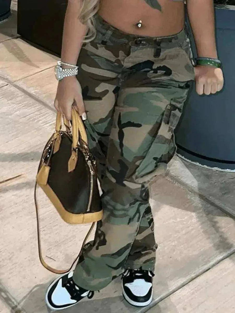 Camo Print Side Pocket Cargo Pants For WomenBe bold and confident with these Camo Print Side Pocket Cargo Pants for Women! Designed with a camouflage print and side pockets, these pants are both stylish and fuPantsPlush Fashions ShopPlush Fashion Shop