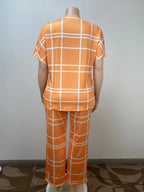 Plus size women's two-piece set with striped grid print and casual round neck from Plush Fashion Hub, featuring a comfortable, stylish design.