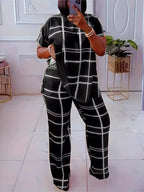 Plus size women’s two-piece set by Plush Fashion Hub featuring a striped grid pattern and casual round neck top.
