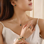 Plum Blossom Flower necklace and earring set featuring five-leaf design, crafted by Plush Fashion Hub, displayed on a neutral background.