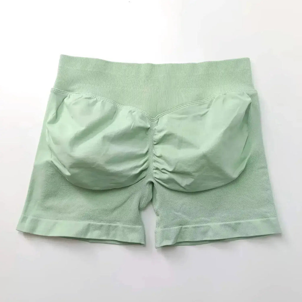 Women's seamless scrunch butt gym shorts for fitness and yoga, designed for high-performance workouts by NCLAGEN Gym Wear.