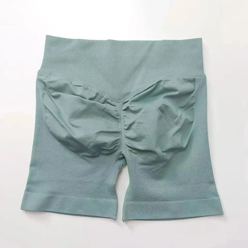Women's seamless scrunch butt gym shorts for fitness and yoga, designed for high-performance workouts by NCLAGEN Gym Wear.