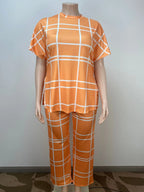 Plus size women’s Elements striped grid printed casual two-piece set with round neck top, by Plush Fashion Hub.