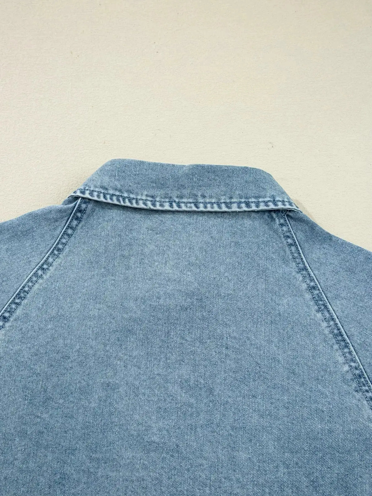 Plush Fashion Hub denim mini dress with smocked cuffs, flared style, casual button-down design, perfect for everyday wear.