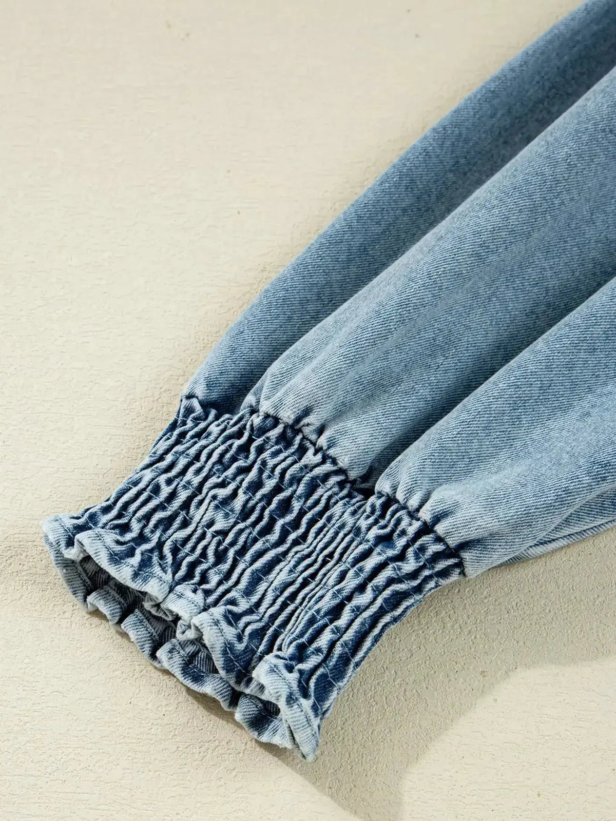 Plush Fashion Hub denim mini dress with smocked cuffs, flared silhouette, casual button-down style, perfect for everyday wear.