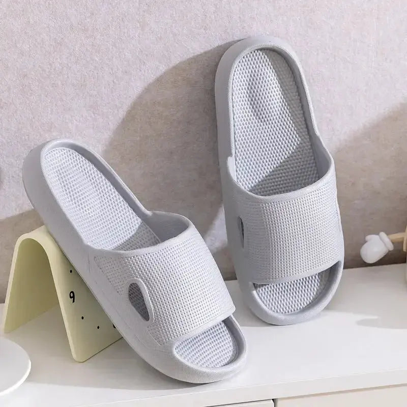 Unisex thick sole EVA bathroom slippers with non-slip soles, solid color indoor slides by Plush Fashion Hub.