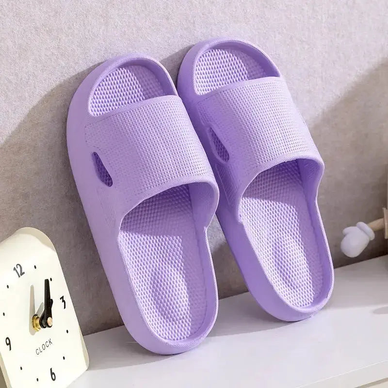Unisex thick sole EVA bathroom slippers with non-slip bottom, solid color indoor slides by Plush Fashion Hub.