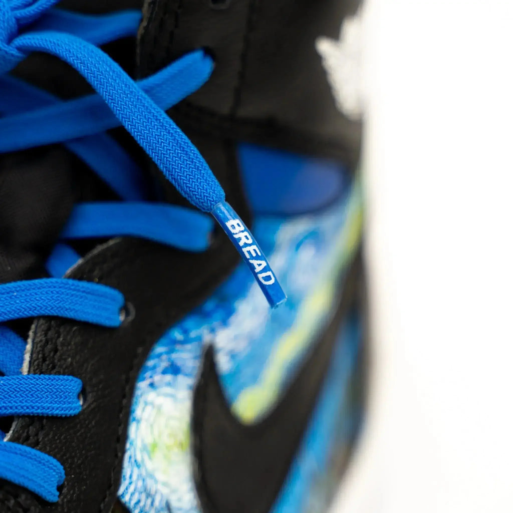 Blue elastic shoelaces by Bread, featuring a vibrant Sonic Blue color, designed for easy slip-on comfort and secure fit.