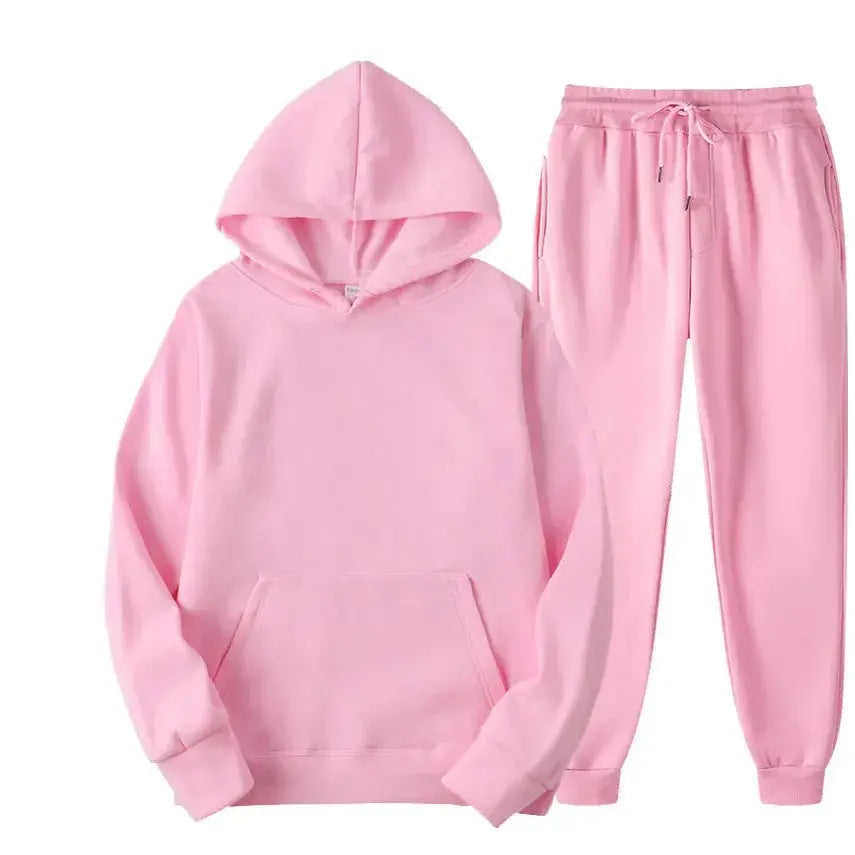 Oversized women's hooded sweatshirt and jogger lounge set in soft polyester fabric by Plush Fashion Hub.