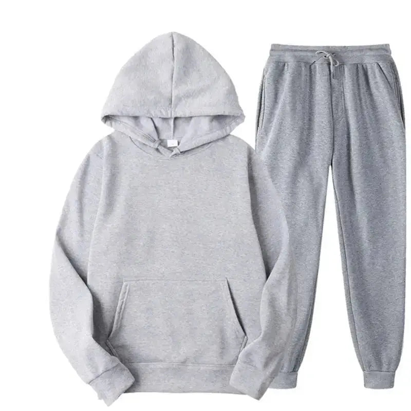 Oversized women's hooded sweatshirt and jogger lounge set in soft polyester, from Plush Fashion Hub, with sparkling fabric details.