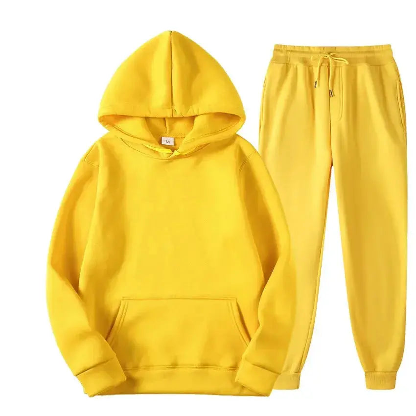 Oversized women's hooded sweatshirt and jogger lounge set in soft polyester, from Plush Fashion Hub, with sparkling fabric details.