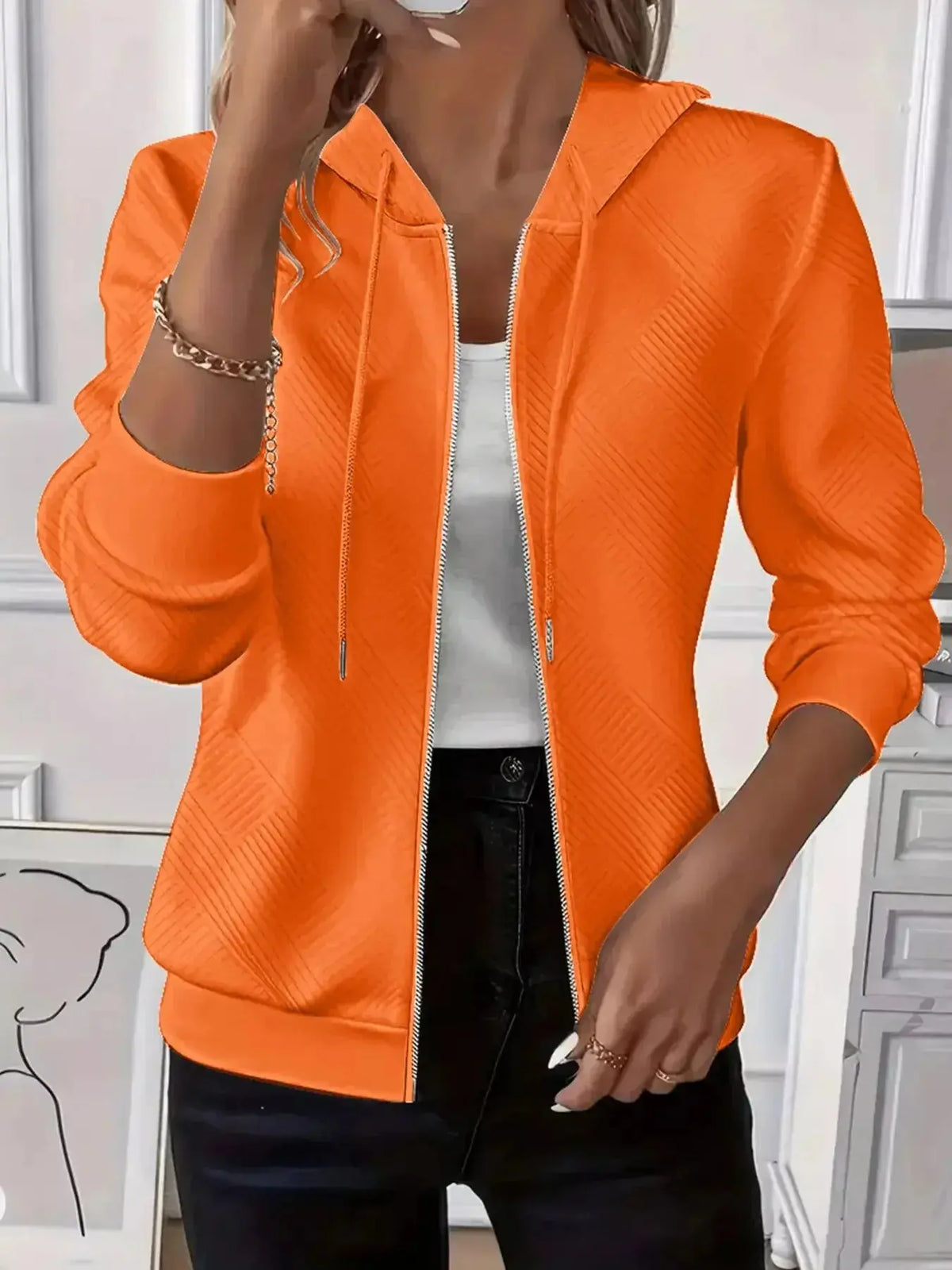 Women’s textured zip-up hoodie with adjustable drawstring from Plush Fashion Hub, showcasing soft fabric and modern fit.