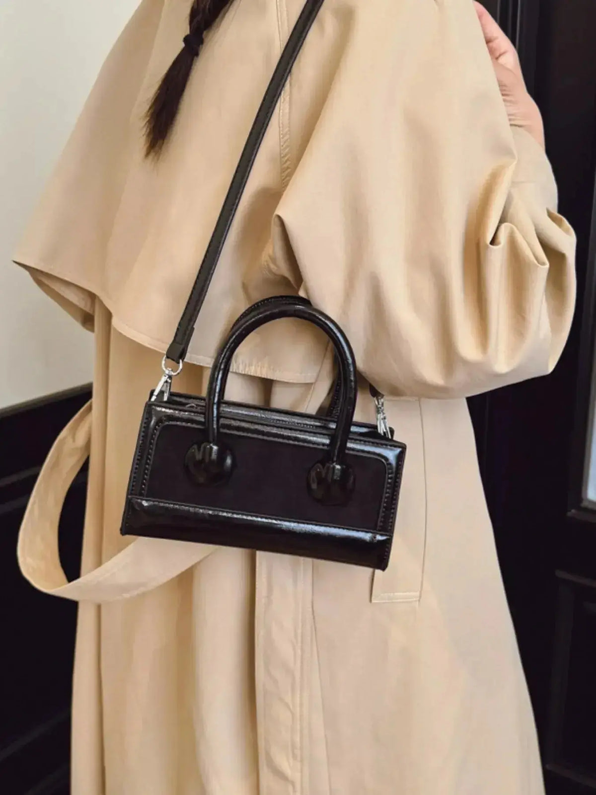 Structured leather crossbody bag with top handle from Plush Fashion Hub, showcasing a sleek, elegant handbag design.