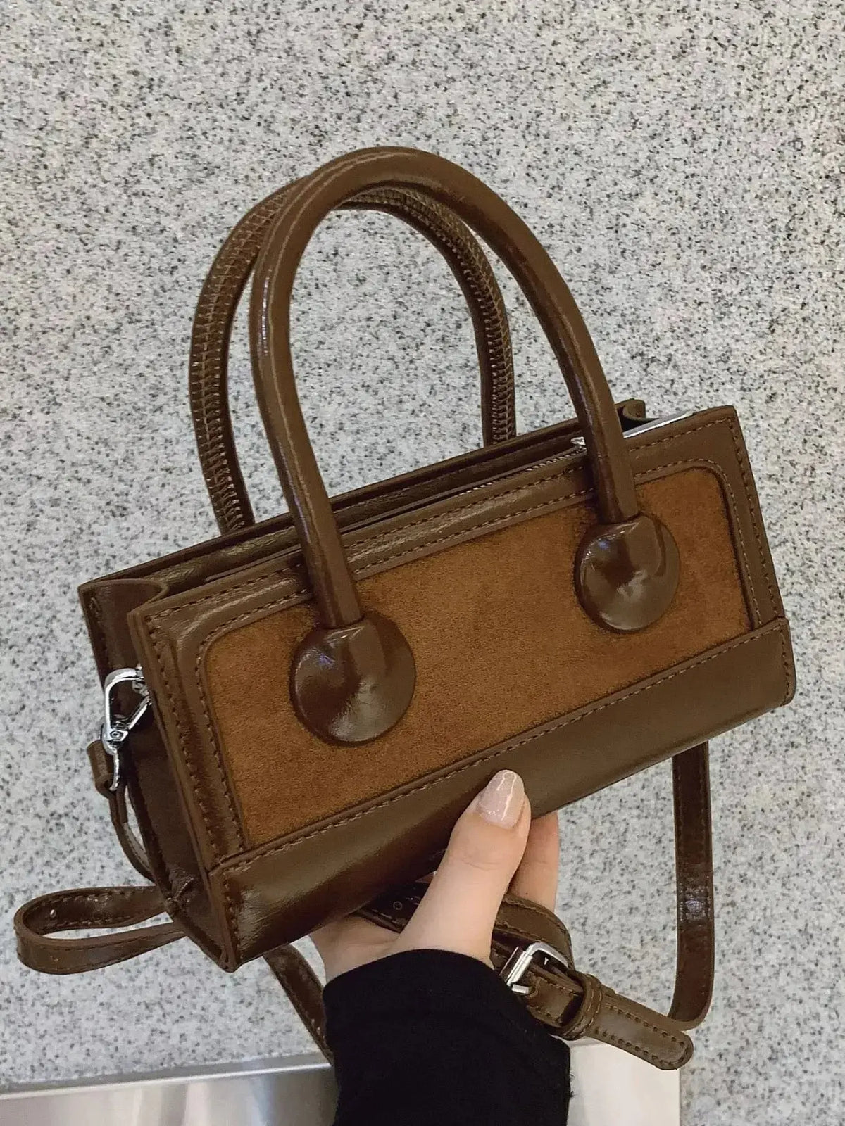 Structured leather top handle crossbody bag by Plush Fashion Hub, featuring a sleek design and versatile carry options.