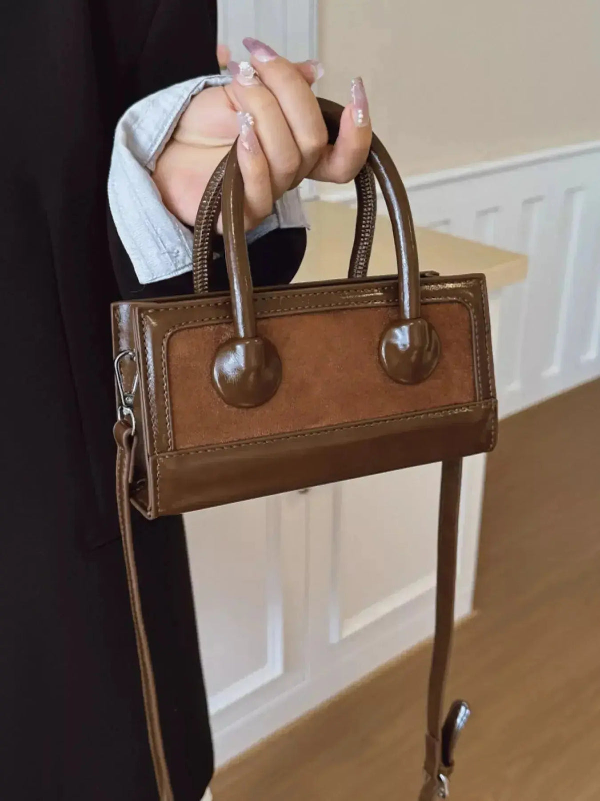 Structured leather top-handle crossbody bag by Plush Fashion Hub with a sleek, elegant design and a sturdy top handle.