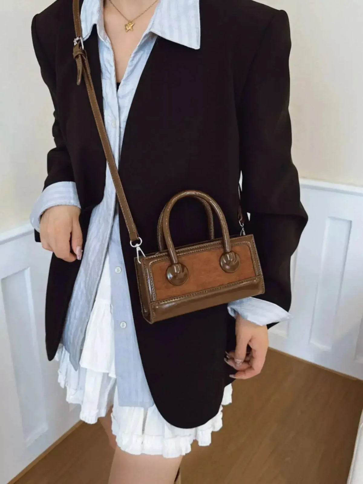 Structured leather crossbody bag with top handle by Plush Fashion Hub, featuring a sleek, elegant handbag design.