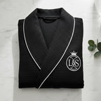 Luxurious Lotus Linen premium waffle piping men's robe hanging open, soft fabric and detailed piping visible.