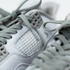 Gray elastic shoelaces by Bread in Vulture Gray color, shown laced through sneaker eyelets for a snug fit.