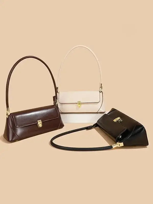 Urban solid leather shoulder bag by Plush Fashion Hub featuring a minimalist zip-up design and crossbody style.